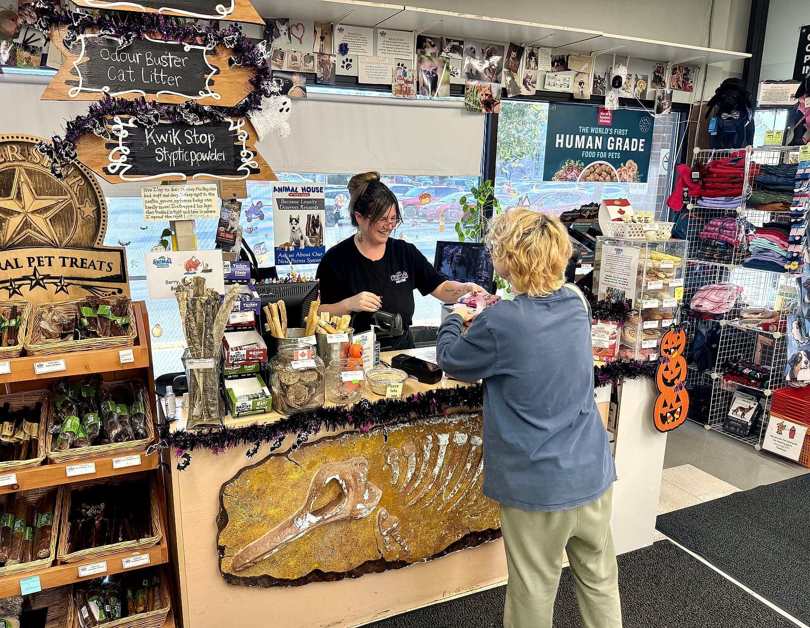A staff member helping a customer at the front counter