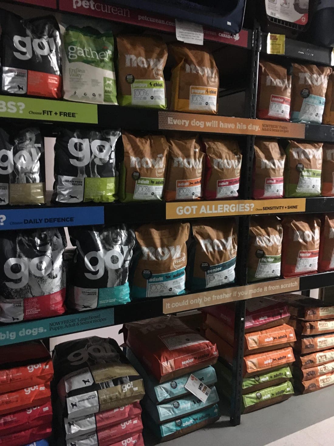 A wall of GO! Solutions and NOW Fresh dog food bags at the Revelstoke store