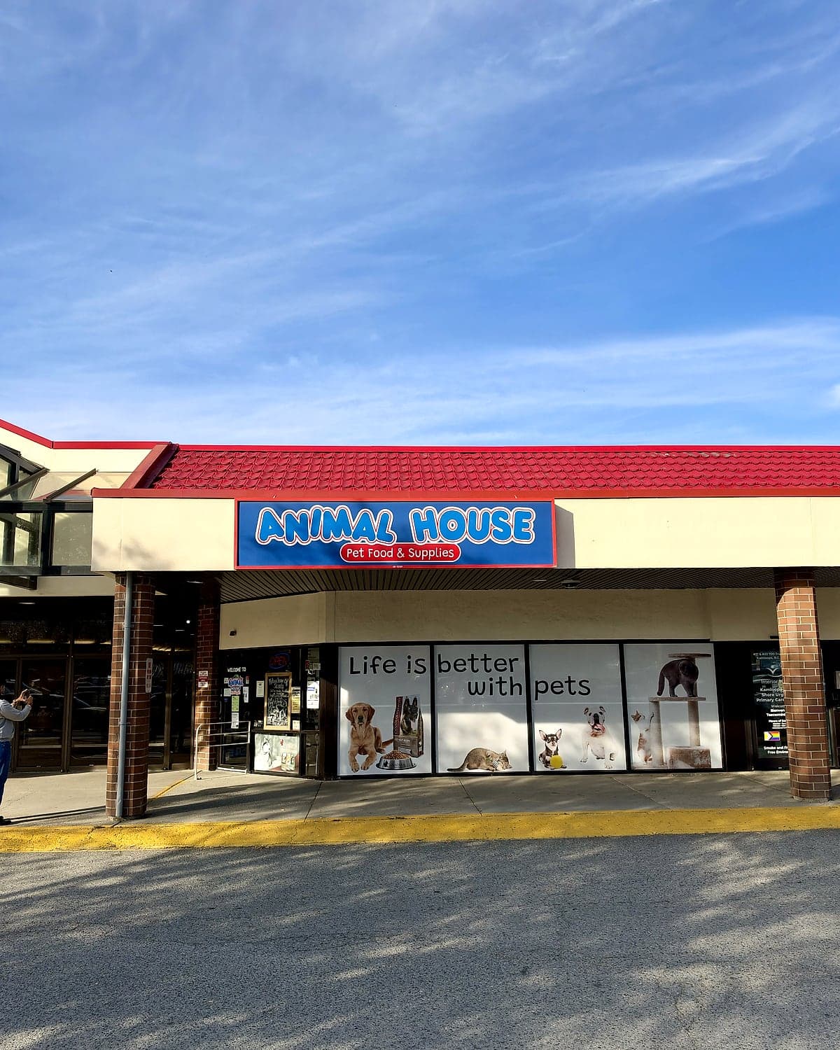The Animal House Pet Food & Supplies sign above the store's front windows